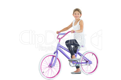 Cute young girl riding bike