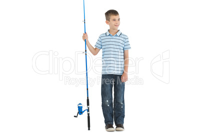 Pensive young boy holding fishing rod