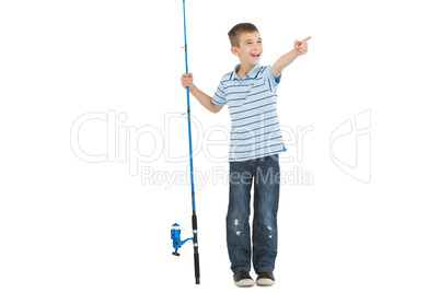 Young boy holding fishing rod pointing