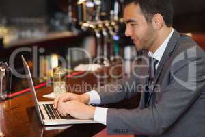 Focused businessman working on his laptop