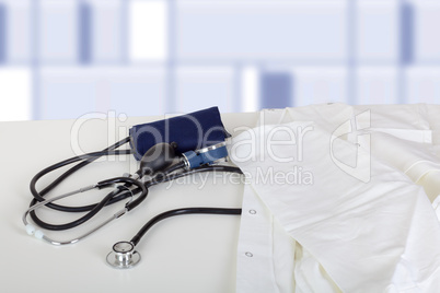 Doctor's coat and stethoscope on the table