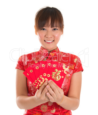 Chinese cheongsam girl holding red packets