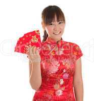 Chinese cheongsam girl showing red packets