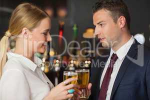 Colleagues clinking their glasses of beer