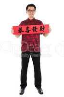 Asian Chinese cheongsam male holding couplet