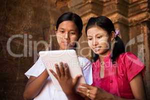 Myanmar girl using digital tablet pc