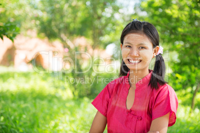 Myanmar girl standing outdoor.
