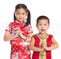 Little oriental children wishing you a happy Chinese New Year