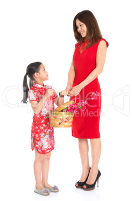 Chinese family holding a gift basket