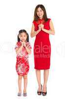 Full body Chinese parent and child greeting to each other