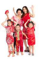 Asian Chinese family wishing you a happy Chinese New Year
