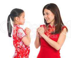 Chinese parent and child greeting to each other