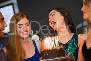 Cheerful friends celebrating birthday together