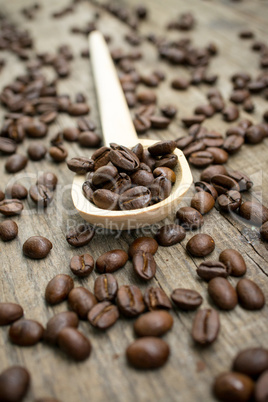 wooden spoon with coffee beans