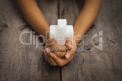 holding a religious cross