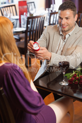 Handsome man making marriage proposal