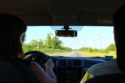 young woman driving the car
