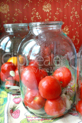 tomatos in jars prepared for preservation