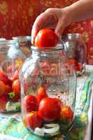 tomatos in jars prepared for preservation