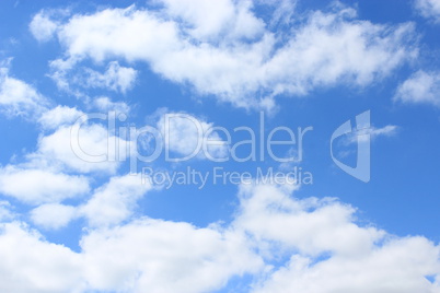 picturesque white clouds on blue sky background