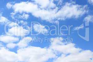 picturesque white clouds on blue sky background