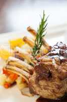 Delicious rack of lamb dish with rosemary sprig