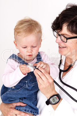 Doctor with stethoscope fun with toddler