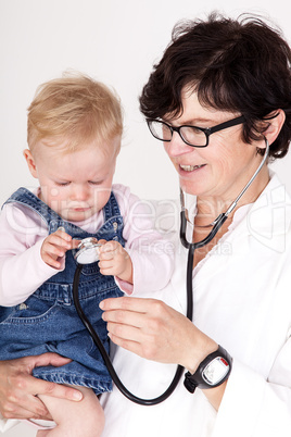 Doctor with stethoscope fun with toddler