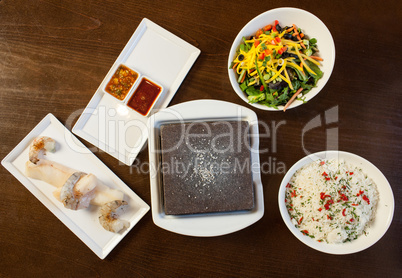 Components of cook it yourself fish dish with hot stone