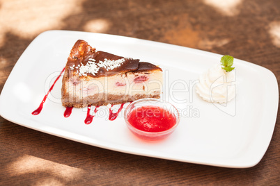 Cheesecake with chantilly cream and coulis