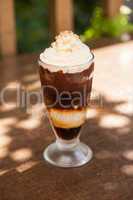 Chocolate sundae with whipped cream and chopped nuts