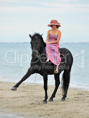 girl and  horse on the beach