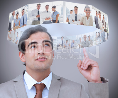 Businessman showing futuristic interface above his head