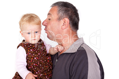 Man holding small child in her arms