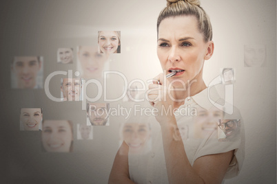 Stern businesswoman encircled by digital interface