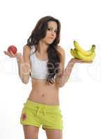 sporty girl with apple and banana