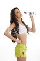 long haird sports girl is drinking water