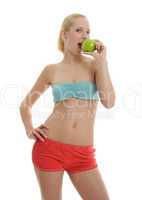 woman in sport dress with green apple