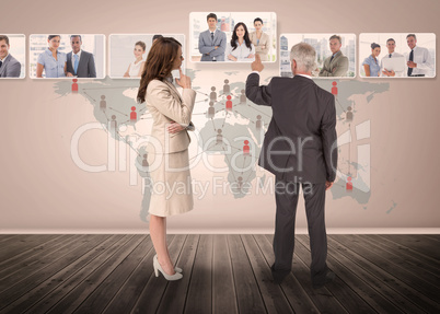 Business people selecting digital interface together