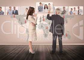 Business people selecting digital interface together