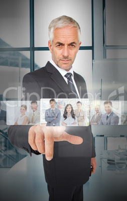 Mature businessman using futuristic interface