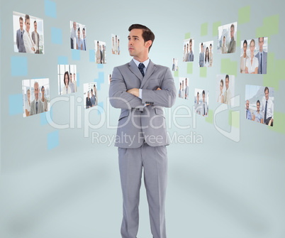 Handsome businessman looking at digital interface