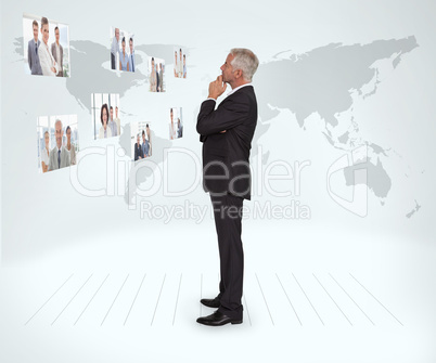 Experienced businessman staring at futuristic interface