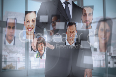 Classy businessman presenting profile pictures
