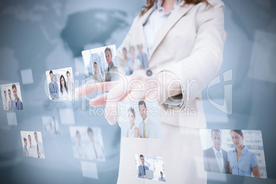 Stylish businesswoman presenting coworkers pictures