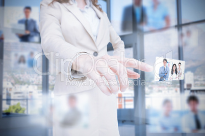 Classy businesswoman presenting coworkers pictures