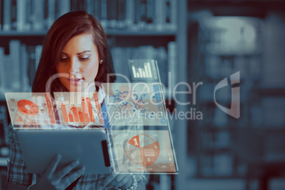 Pretty student working on her futuristic tablet computer