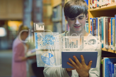 Young man studying on his digital tablet computer