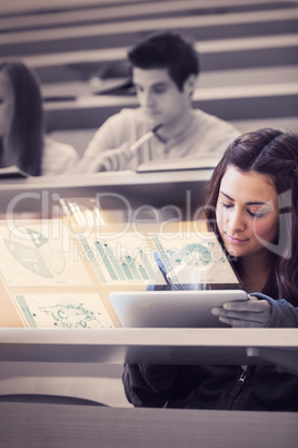 Student analysing graphs on her futuristic tablet computer