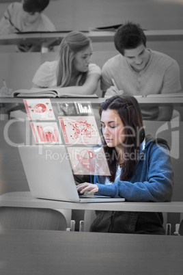 Pretty brunette studying on her futuristic laptop